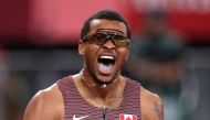 Andre De Grasse of Canada celebrates after winning gold REUTERS/Hannah Mckay