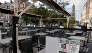 Empty chairs and tables are seen in a closed restaurant bar as owners protest against France's coronavirus disease (COVID-19) safety restrictions in Cambrai, France, August 7, 2021. Reuters/Pascal Rossignol