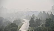 A general view shows the Siberian city of Krasnoyarsk covered with smoke from forest fires, Russia, August 7, 2021. REUTERS/Alexander Manzyuk NO RESALES. NO ARCHIVES
