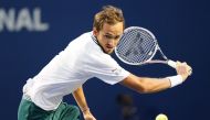 Daniil Medvedev of Russia returns a ball to John Isner of the United States (not pictured) at Aviva Centre