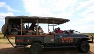 Gladys Kisemei, a tour guide at the Emboo River Camp drives tourists from the Ol Kiombo airstrip using an electric-powered safari vehicle at the Maasai Mara National Reserve in Narok County, Kenya July 16, 2021. Picture taken July 16, 2021. REUTERS/Monica