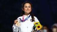 Tokyo 2020 Olympics - Athletics - Women's Marathon - Medal Ceremony - Olympic Stadium, Tokyo, Japan – August 8, 2021. Bronze medallist Molly Seidel of the United States celebrates on the podium REUTERS/Antonio Bronic

