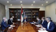 Lebanon's President Michel Aoun meets with Lebanon's caretaker Prime Minister Hassan Diab, Central Bank Governor Riad Salameh, and caretaker Finance Minister Ghazi Wazni at the presidential palace in Baabda, Lebanon August 21, 2021.
