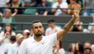 Australia's Nick Kyrgios waves to the spectators after losing his match by a walkover as he sustained an injury Reuters/Peter Nicholls/File Photo