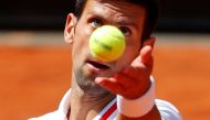 FILE PHOTO:Serbia's Novak Djokovic in action during his quarter final match against Greece's Stefanos Tsitsipas REUTERS/Guglielmo Mangiapane
