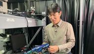 Ko Seung-hwan, mechanical engineering professor at Seoul National University, looks at Chameleon robot covered with artificial skin, in Seoul, South Korea, September 7, 2021. Picture taken September 4, 2021. REUTERS/Minwoo Park
