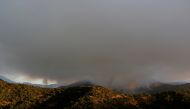 A wildfire burns on Sierra Bermeja mountain, in Genalguacil, near Estepona, Spain, September 11, 2021. REUTERS/Jon Nazca