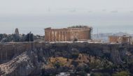 The Parthenon temple is seen atop the empty Acropolis hill archaeological site, closed to the public during a heatwave in Athens, Greece, July 30, 2021. REUTERS/Costas Baltas
