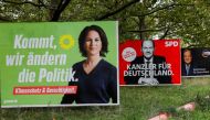 Election campaign billboards featuring the three top candidates for the German chancellery (the Greens' Annalena Baerbock, SPD's Olaf Scholz and CDU's Armin Laschet) stand on a roadside in Berlin, Germany, September 10, 2021. Reuters/Michele Tantussi/File