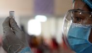 A nurse prepares a dose of China's Sinovac coronavirus disease (COVID-19) vaccine at an industrial park in Phnom Penh, Cambodia, April 7, 2021. REUTERS/Cindy Liu/File Photo