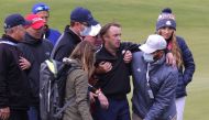 Actor Tom Felton receives medical attention during a practice round REUTERS/Mike Segar
