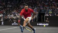 Team World player Nick Kyrgios attempts a shot between his legs during the first set of his match against Team Europe player Stefanos Tsitsipas at TD Garden. Richard Cashin-USA Today Sports