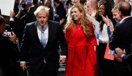 Britain's Prime Minister Boris Johnson departs with his wife Carrie Johnson after delivering a speech during the annual Conservative Party Conference, in Manchester, Britain, October 6, 2021. Reuters/Toby Melville