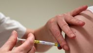 A volunteer receives a dose of CureVac vaccine or a placebo during a study by the German biotech firm CureVac as part of a testing for a new vaccine against the coronavirus disease (COVID-19), in Brussels, Belgium March 2, 2021. REUTERS/Yves Herman/File P