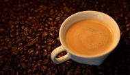 An illustration picture shows a coffee cup and roasted coffee beans in Brussels, Belgium May 1, 2017. REUTERS/Eric Vidal/Illustration