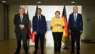 US President Joe Biden, Germany's Chancellor Angela Merkel, Britain's Prime Minister Boris Johnson and France's President Emmanuel Macron pose for a family photo during their meeting to discuss Iran's nuclear program, on the sidelines of the G20 leaders' 