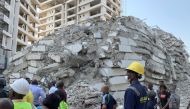 Emergency personnel stands by the debris of the collapsed building in Ikoyi, Lagos, Nigeria, November 1, 2021. Picture taken November 1, 2021. REUTERS/Nneka Chile