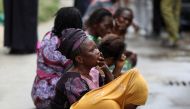 Relatives wait outside as rescue workers continue to conduct search and rescue effort at the site of a collapsed building in Ikoyi, Lagos, Nigeria November 2, 2021. REUTERS/Temilade Adelaja/File Photo