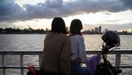 People ride a ferry at sunset on the Mekong River, amid a coronavirus disease (COVID-19) outbreak, in Phnom Penh, Cambodia, August 12, 2021. REUTERS/Cindy Liu/File Photo