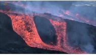 A flow of lava is observed near la Laguna mountain on the Canary island of La Palma, Spain November 22, 2021 in this screen grab obtained from a social media video. Involcan/via REUTERS