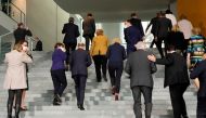 Acting German Chancellor Angela Merkel leaves, along with members of her government, after posing for a group photo after the weekly cabinet meeting at the Chancellery in Berlin, Germany, November 24, 2021. Markus Schreiber/Pool via REUTERS