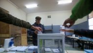 People point at the ballot box as a man walks to cast his vote during the local elections, in Algiers, Algeria November 27, 2021. REUTERS/Ramzi Boudina