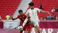 December 3, 2021 Bahrain's Ismaeel Abdullatif in action with Iraq's Manaf Younnes REUTERS/Suhaib Salem