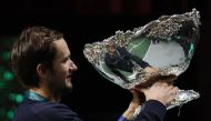 Russian Tennis Federation's Daniil Medvedev celebrates with trophy on the podium winning the Davis Cup REUTERS/Sergio Perez