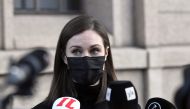 Finnish Prime Minister Sanna Marin holds a news conference outside the Finnish Parliament building in Helsinki, Finland December 8, 2021. Markku Ulander/Lehtikuva/via REUTERS
