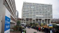 People queue outside a coronavirus disease (COVID-19) vaccination centre at St Thomas's Hospital in London, Britain, December 13, 2021. Reuters/Hannah McKay