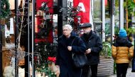 People do their Christmas shopping before the Dutch government's expected announcement of a 