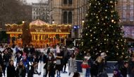 People ice skate around the Christmas tree at the Natural History Museum amid the coronavirus disease (COVID-19) outbreak, in London, Britain December 21, 2021. REUTERS/Kevin Coombs
