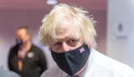 British Prime Minister Boris Johnson visits COVID-19 vaccination centre, amidst the spread of the coronavirus disease (COVID-19) pandemic, at the Rainbow Pharmacy in the Open University Campus, Walton Hall, Milton Keynes, Britain, December 29, 2021. Geoff Pugh/Pool via REUTERS
