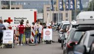 People queue in their cars at a a drive-in vaccination center against the coronavirus disease (COVID-19) in Berlin, Germany, July 17, 2021. REUTERS/Axel Schmidt

