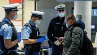 Federal police officers check an air passenger arriving from Britain at the Frankfurt Airport, as the spread of the coronavirus disease (COVID-19) continues, in Frankfurt, Germany, January 30, 2021. REUTERS/Ralph Orlowski