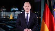 German Chancellor Olaf Scholz poses for photographs during the television recording of his annual New Year's speech at the chancellery in Berlin, Germany December 30, 2021. Kay Nietfeld/Pool via REUTERS