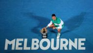 FILE PHOTO: Serbia's Novak Djokovic celebrates with the trophy after winning his final match against Russia's Daniil Medvedev REUTERS/Kelly Defina/File Photo
