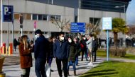 People queue to get tested for the coronavirus disease (COVID-19) after the Christmas holiday break, amid the COVID-19 pandemic, at Doce de Octubre Hospital in Madrid, Spain December 27, 2021. REUTERS/Javier Barbancho/File Photo