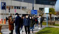 FILE PHOTO: People queue to get tested for the coronavirus disease (COVID-19) after the Christmas holiday break, amid the COVID-19 pandemic, at Doce de Octubre Hospital in MADRID, Spain December 27, 2021. REUTERS/Javier Barbancho/File Photo
