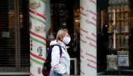 A woman wearing a protective face mask walks in downtown Budapest, after Hungarian government imposed a nationwide lockdown to contain the spread of the coronavirus disease (COVID-19), Hungary, November 11, 2020. REUTERS/Bernadett Szabo/File Photo