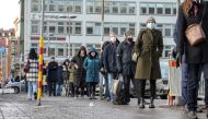 People queue for a drop-in COVID-19 vaccination at Stockholm City Terminal station, Sweden January 13, 2022. TT News Agency/Anders Wiklund via REUTERS