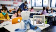 A seven-year-old schoolboy Joshua attends his school lesson via a robot avatar, placed in his classroom, in Berlin, Germany January 13, 2022. Picture taken January 13, 2022. REUTERS/Hannibal Hanschke