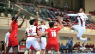 A Qatari player prepares to shoot at the goal during the Asian Men’s Handball Championship Group C match against Oman, yesterday.