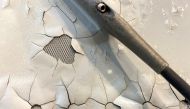 FILE PHOTO: An undated image shows what appears to be paint peeling, cracking and exposed expanded copper foil (ECF) on the fuselage of a Qatar Airways A350 aircraft grounded by the Qatari regulator. Image obtained by Reuters