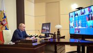 Russian President Vladimir Putin chairs a meeting with members of the Security Council via a video link at the Novo-Ogaryovo state residence outside Moscow, Russia January 28, 2022.