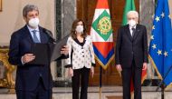 Italian Chamber of Deputies President Roberto Fico speaks next to Senate President Maria Elisabetta Alberti Casellati and Italian President Sergio Mattarella, after Mattarella was re-elected. Italian Presidency/Paolo Giandotti/Handout via Reuters