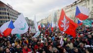 Demonstrators wave flags during a protest against Czech government's restrictions imposed to contain the spread of the coronavirus disease (COVID-19) in Prague, Czech Republic January 30, 2022. REUTERS/Jiri Skacel
