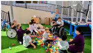 The mall donated plastic balls for children with special needs. 