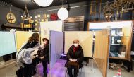 Judith Johanna Pawelke takes a coronavirus disease (COVID-19) test in her interior design store, which is currently being used as a COVID-19 test station in downtown Munich, Germany, January 19, 2022. REUTERS/Lukas Barth

