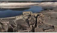 A general view shows the ancient village of Aceredo that had been submerged by Limia river in the 1990s after the dam was built in Concello de Lobios, Spain, February 10, 2022. Picture taken with a drone. REUTERS/Miguel Vidal